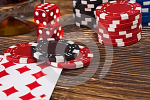 Wooden table concept of playing poker from chips and cards