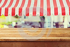 Wooden table counter with awing for product montage display