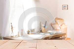 Wooden table on defocused curtain window and stationery box with