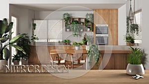 Wooden table, desk or shelf with potted grass plant, house keys and 3D letters making the words interior design, over modern