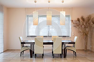 Wooden table in dinning room photo