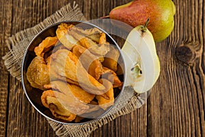 Wooden table with dried Pears (selective focus)