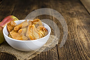 Wooden table with dried Pears (selective focus)