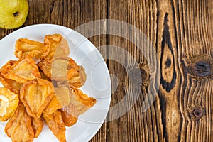 Wooden table with dried Pears (selective focus)