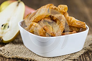 Wooden table with dried Pears (selective focus)