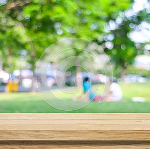 Wooden table for food, product display over blur green garden background, Empty wooden shelf, desk and blur tree park with bokeh