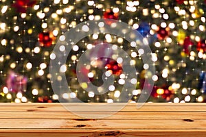 Wooden Table in Front of Abstract Blurred Background of Christmas Lights