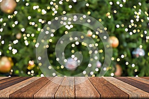 Wooden table in front blurred christmas background, bokeh, copy space