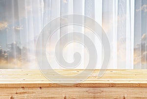 Wooden table in front of blurred window light