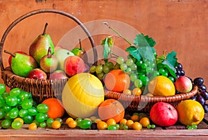 Wooden table full fresh fruit baskets