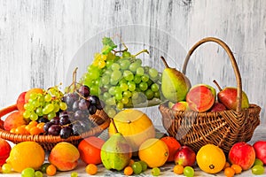 Wooden table full fresh fruit baskets