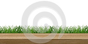 a wooden table on a grass background