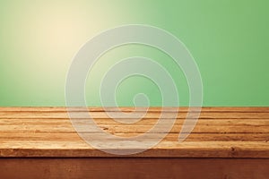 Wooden table and green background for product montage display