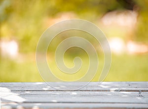 Wooden table on a green blurred background