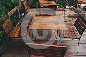 Wooden table in a green garden