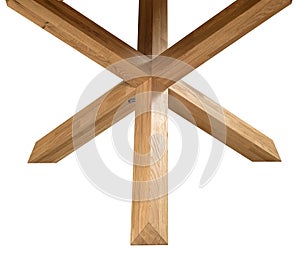 Wooden table legs isolated over white background, close view photo, crossed star shaped legs, wooden eco furniture elements