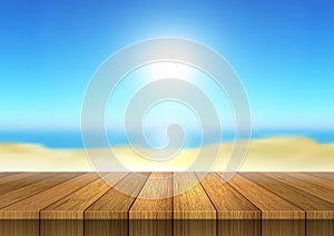 Wooden table looking out to defocussed beach landscape