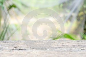 Wooden table on nature garden background for presentation product