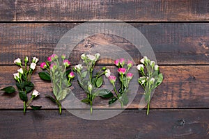 The wooden table with roses, top view