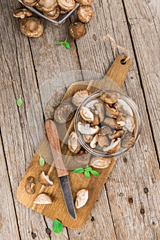 Wooden table with Shiitake mushrooms, selective focus