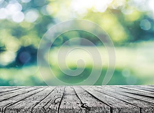 Wooden table and spring blurred background