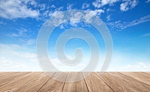 Wooden table top with blue sky