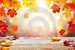 Wooden table top on blur autumn background