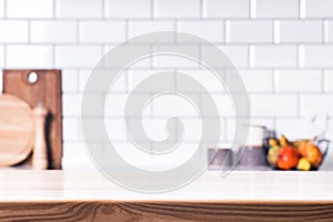 Wooden table top and blurred kitchen background.