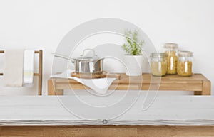 Wooden table top with blurred kitchen background for product display