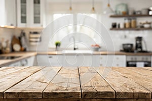 Wooden table top with blurred kitchen background