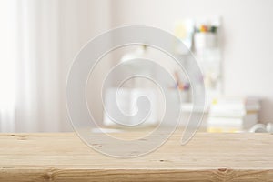 Wooden table top with blurred modern student room background