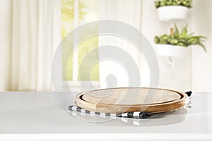 Wooden table top with cutting board and space for products.