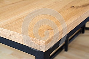 Wooden table top edge and corner.