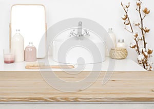 Wooden table top for product display and blurred bathroom background