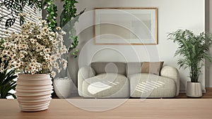 Wooden table top or shelf with pottery vase with daisies, wild flowers, over minimal white living room with frame mockup,