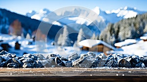 Wooden table top on snowy mountains background