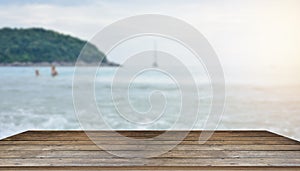 Wooden table tops on the blurry sea floor