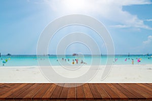 Wooden table tops on the blurry sea floor. clear sky