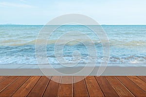 Wooden table tops on the blurry sea floor. clear sky