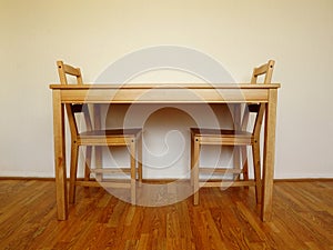 Wooden table and two chairs