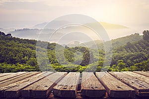 Wooden table and view of mountain with sun light