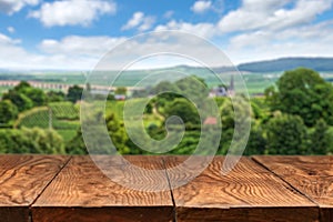 Wooden table with vineyard landscape