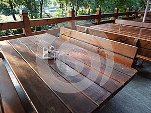 Wooden tables and bench on terrace photo