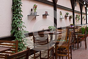 Wooden tables and chaires on terrace photo