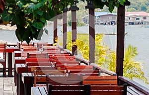 Wooden Tables and Chairs at a open Terrace Restaurant