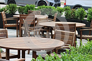 Wooden Tables on a patio in the Art\'s Distict that face the western end of the Art\'s Districte