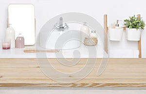 Wooden tabletop for product display over defocused bathroom interior background