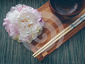 Wooden tablewear with peony flower decor photo