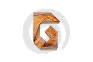 Wooden tangram puzzle as English alphabet letter G