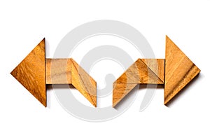 Wooden tangram puzzle in directioinal arrow shape